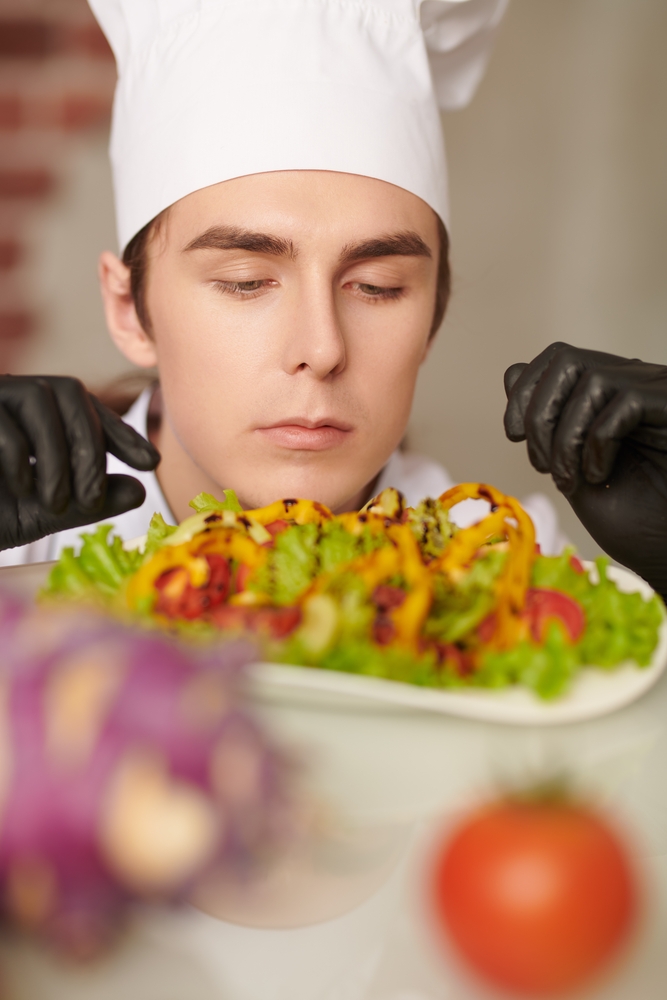 Chef looking at his dish